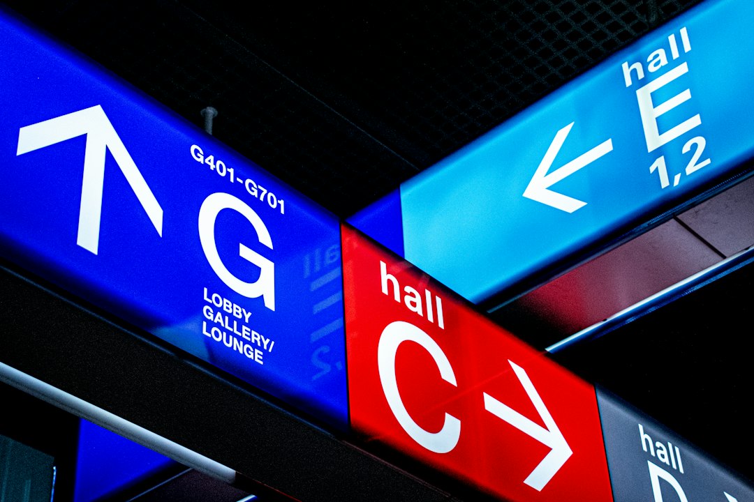Representative interior directional wayfinding signage with arrows.